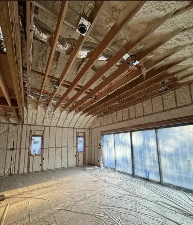 Interior walls and ceiling insulated with spray foam during new construction in Holly Ridge